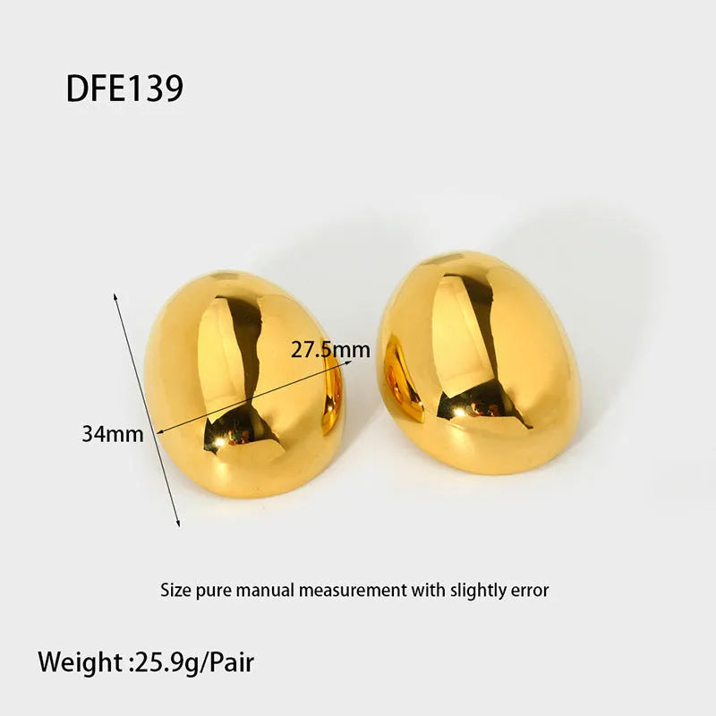 Close-up of simple geometric stainless steel stud earrings with 18K gold plated glazed finish and line design.