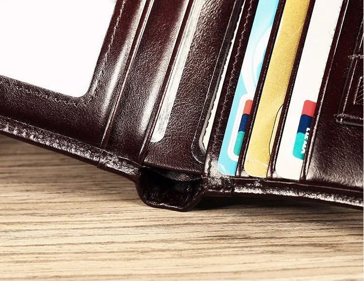 Men's leather wallet showing internal organisation compartments for cards, cash and coins