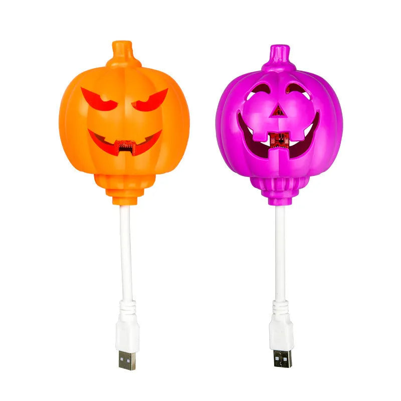 Plastic pumpkin lamp with USB charging cable in yellow or purple light colour