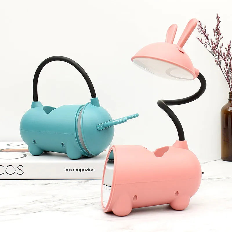 Cartoon-style plastic desk lamp with built-in pen container in dark blue colour