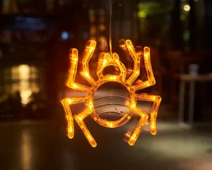 Halloween window hanging LED lights with suction cups showing multiple horror-themed designs powered by batteries