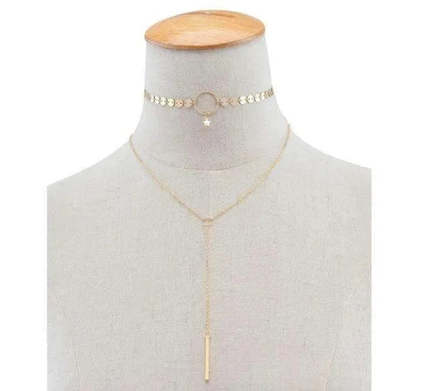 Star Goddess gold duo layering choker necklace on display