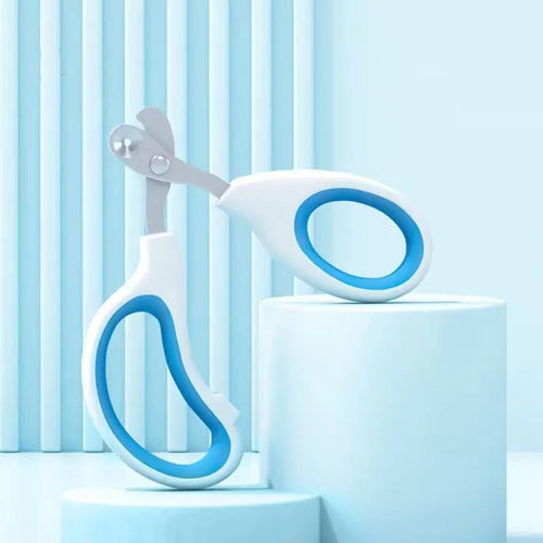 Blue pet nail clippers with circular cutting hole and cushioned non-slip handles on a white background.
