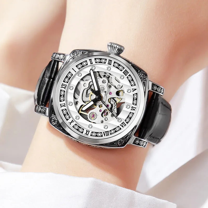 Leather strap mechanical watch with luminous hands showing black, red, steel strip and white colour options