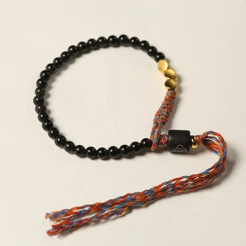 Hand-woven obsidian bracelet strap showing textured detail and 4mm width