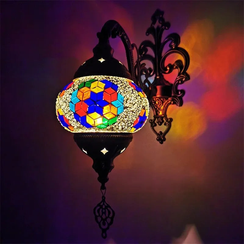 Bohemian iron wall lamp with bronze electroplated finish and primary colour glass shade, measuring 14cm diameter and 40cm height