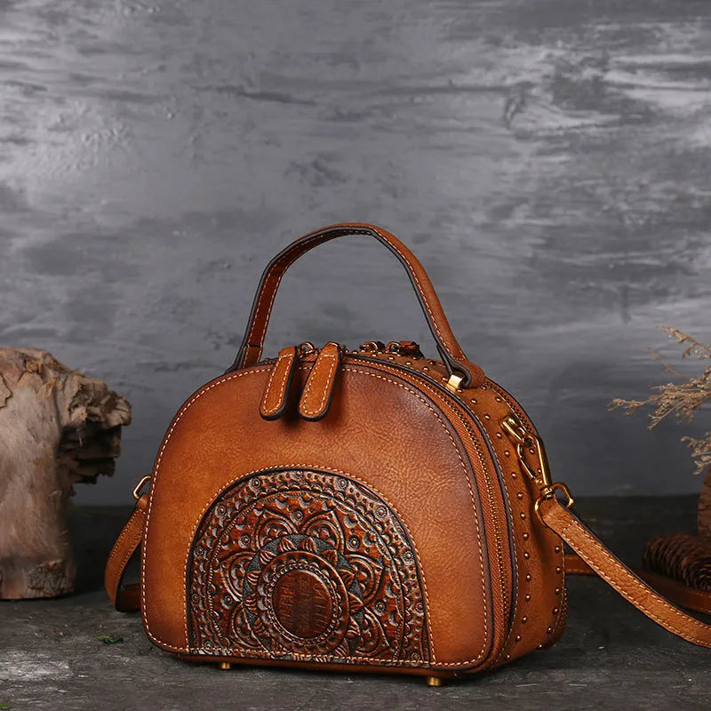 Vintage cowhide leather handbag with suede accents showing interior compartments including ID bag and mobile phone pocket