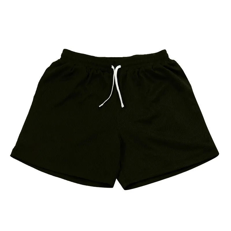 Men's solid-colour mesh quick-drying shorts in chemical fibre fabric for athletic use