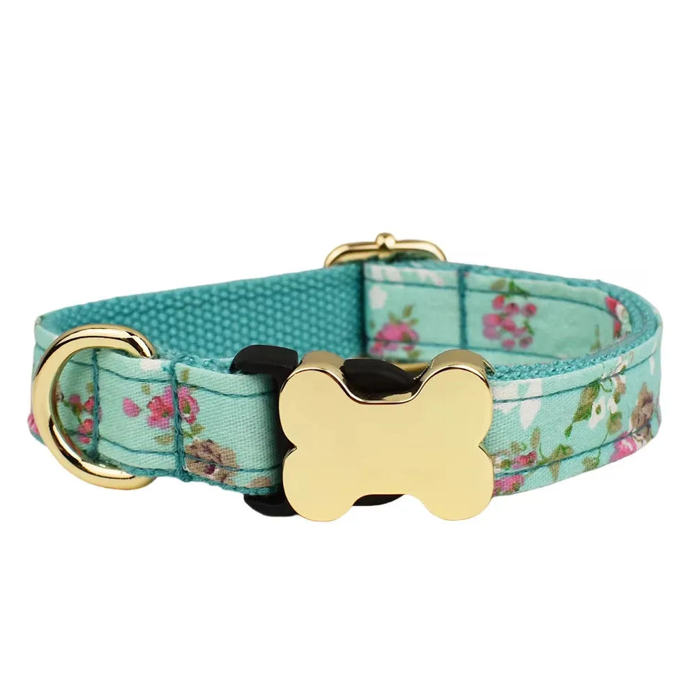 Flat nylon dog collar with grid print and a bone-shaped metal buckle on a white background.