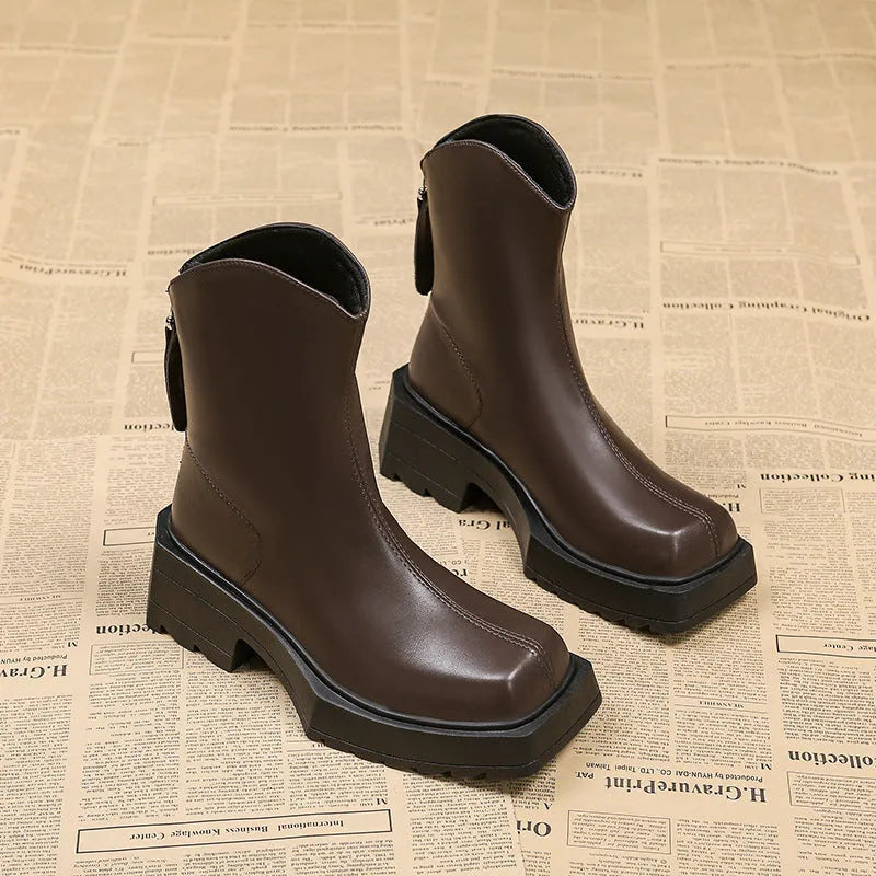 Black platform Martin boots for women with square toe, high heel, and back zipper.