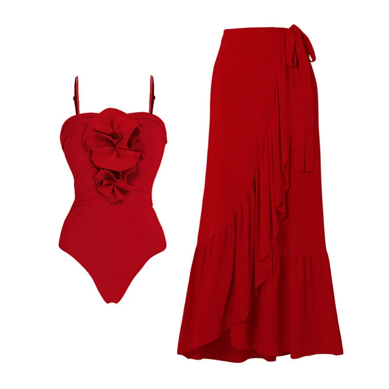 Red floral print women's one-piece swimsuit with V-neck halter and detachable long skirt on a model.