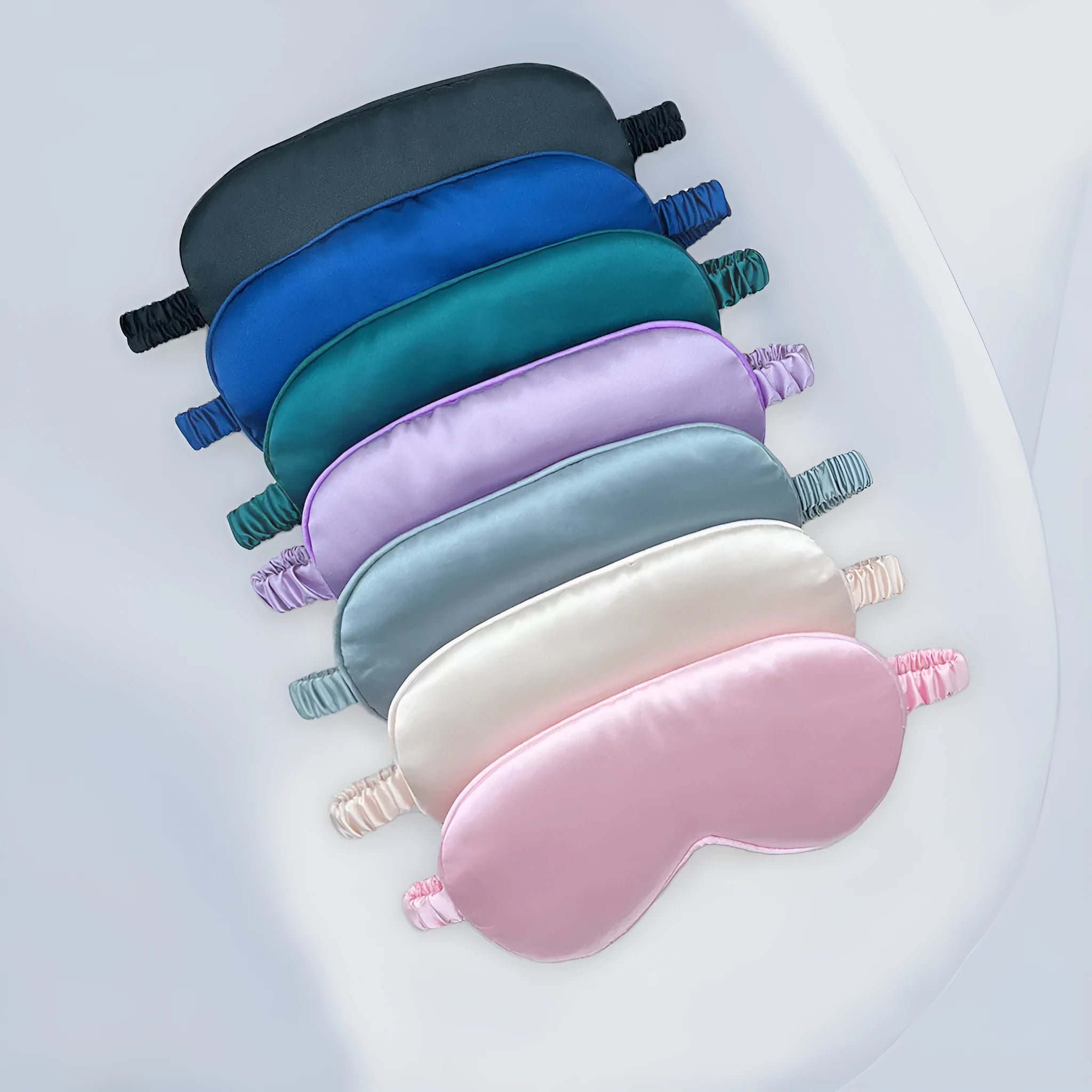 Reversible rayon satin sleep mask in a choice of colours with an elastic headband.