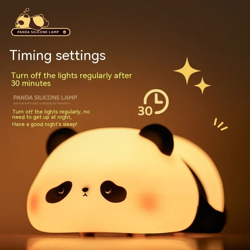 White panda-shaped night light with black accents measuring 150mm tall with USB charging port
