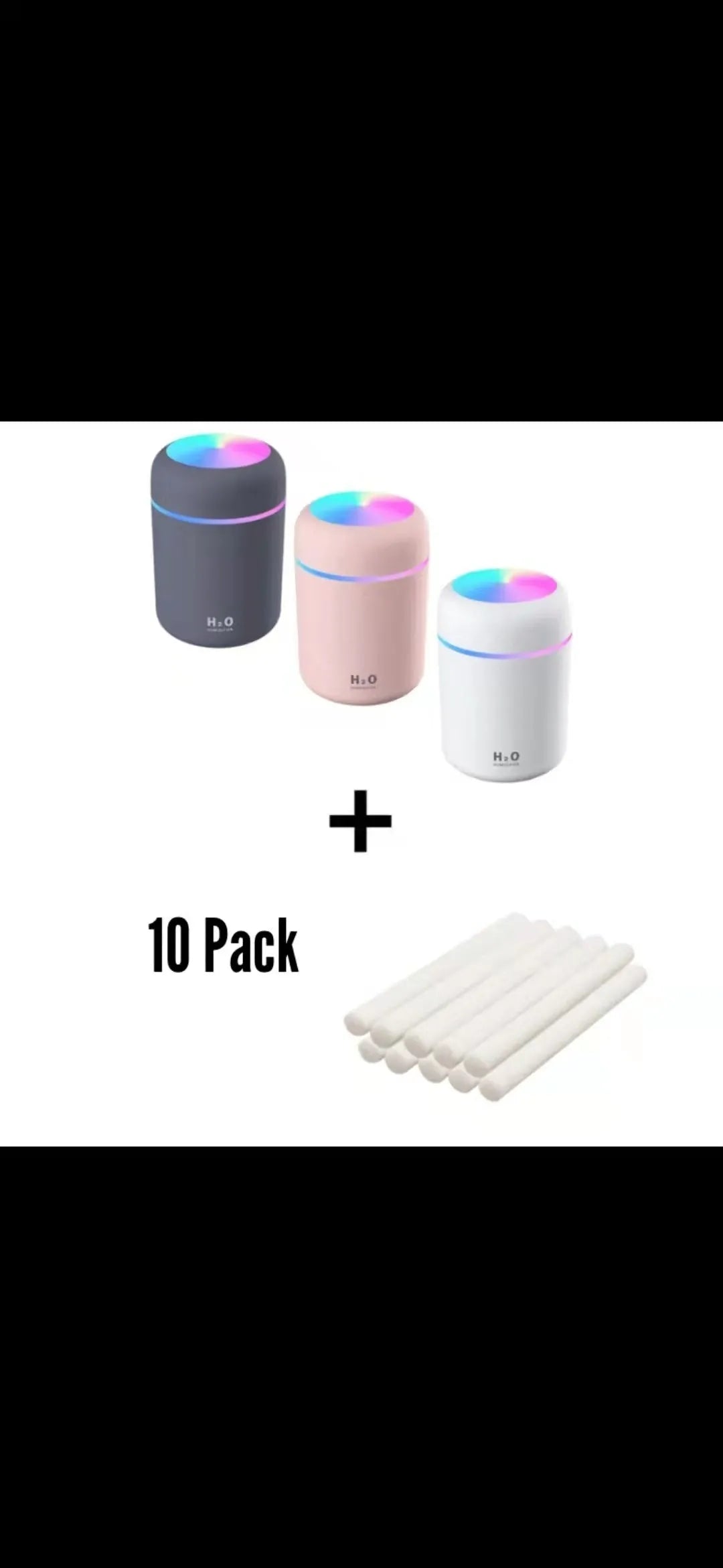 Pink USB mini humidifier with LED lights and water tank on desk