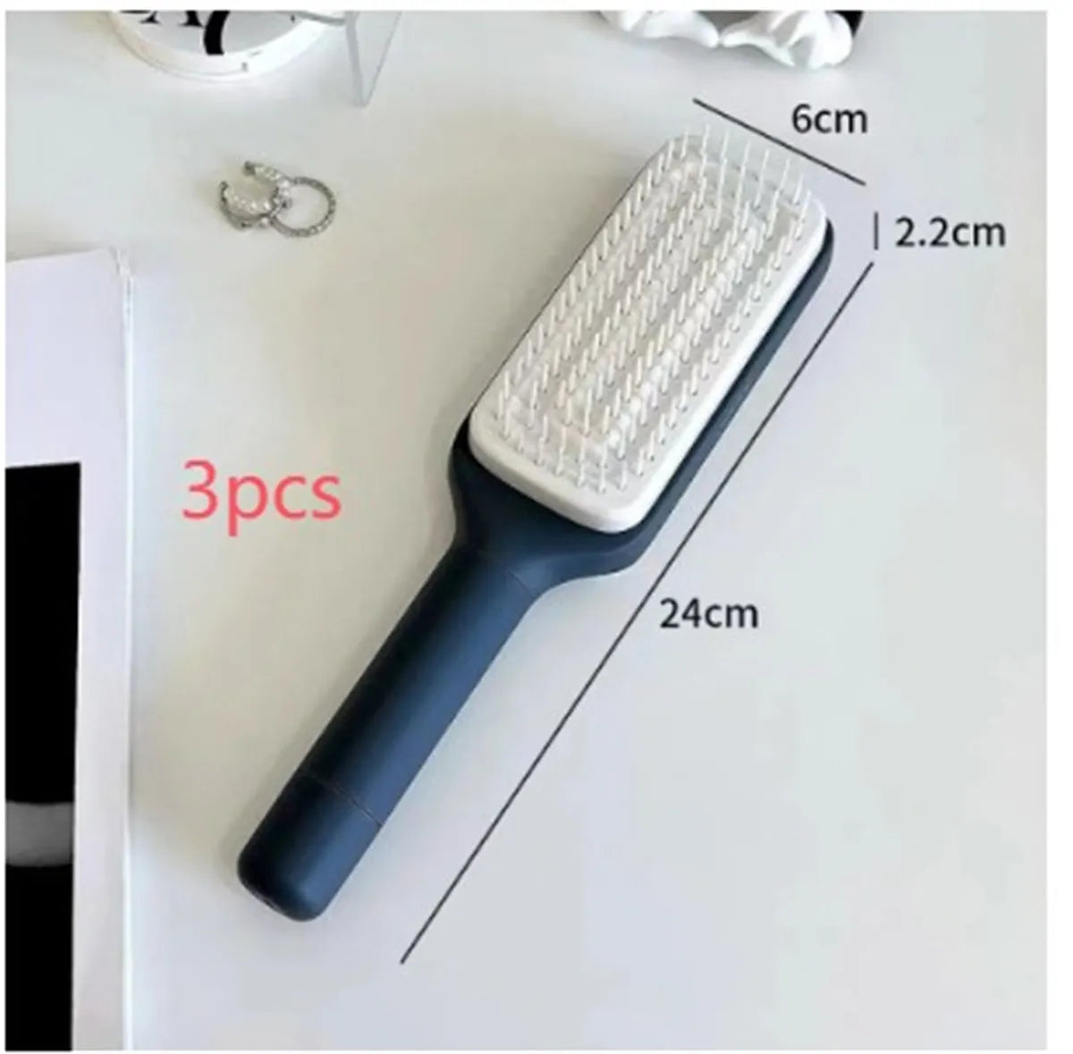 Roland purple and lunar rock grey self-cleaning hair brush with anti-static massage comb teeth.