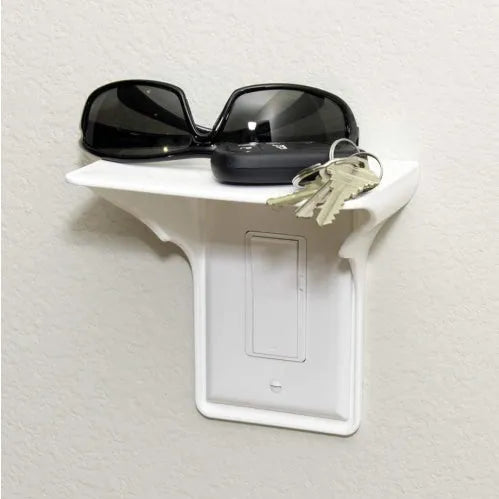White plastic socket rack for tool organisation on a workbench.
