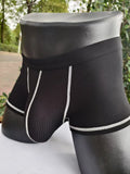 Men's solid colour boxer shorts on a white background, showing thin breathable fabric.