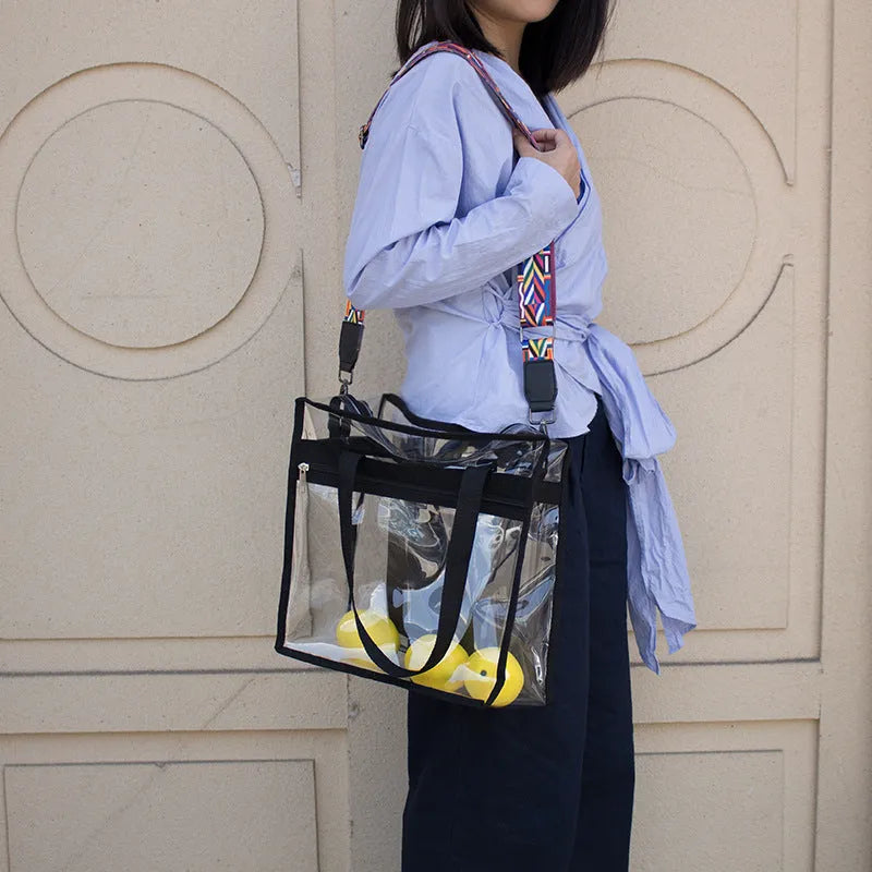 Women's PVC messenger bag with transparent front compartment and crossbody strap in a selection of colours.