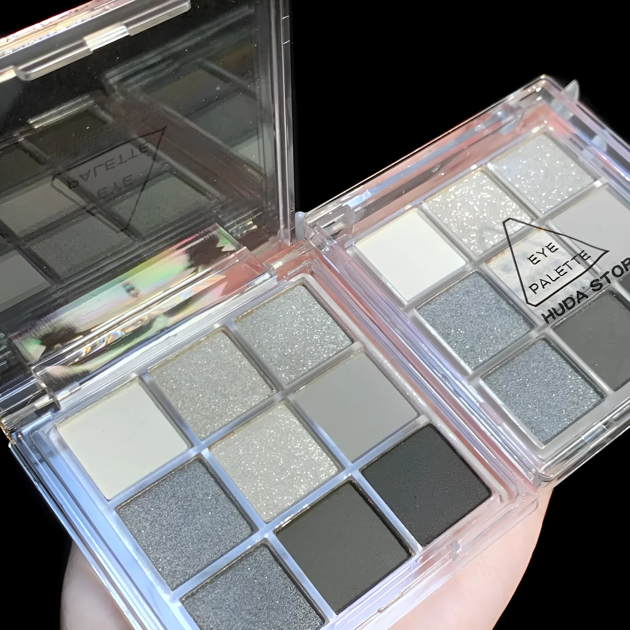 Smoked nine-colour eye shadow compact showing white silver black iron grey cosmetic shades