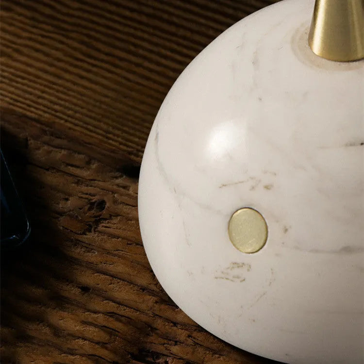 Clear glass desk lamp with dimmable LED light and touch switch on base.
