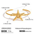 Stainless steel open-ended bracelet with starfish charm on a flat surface