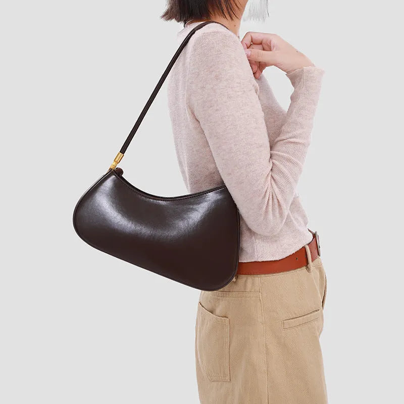 Women's retro oval PU leather shoulder bag in seven colour options with single strap and internal zipper compartment