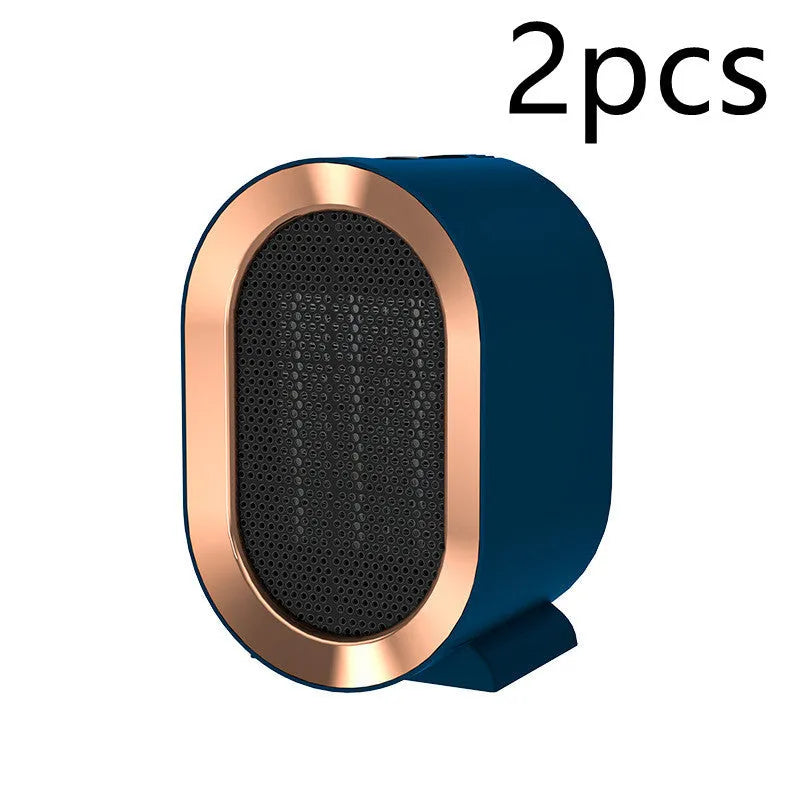 Black desktop electric fan heater with mechanical dial controls and ceramic heating technology