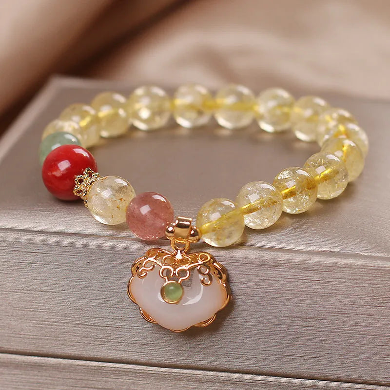 Original design women's alloy bracelet with a natural yellow hair crystal citrine jade ruyi pendant charm.