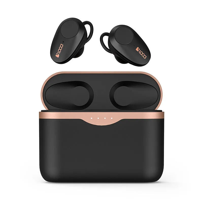 Black wireless Bluetooth headset with bilateral earpieces and a charging stand on a table.