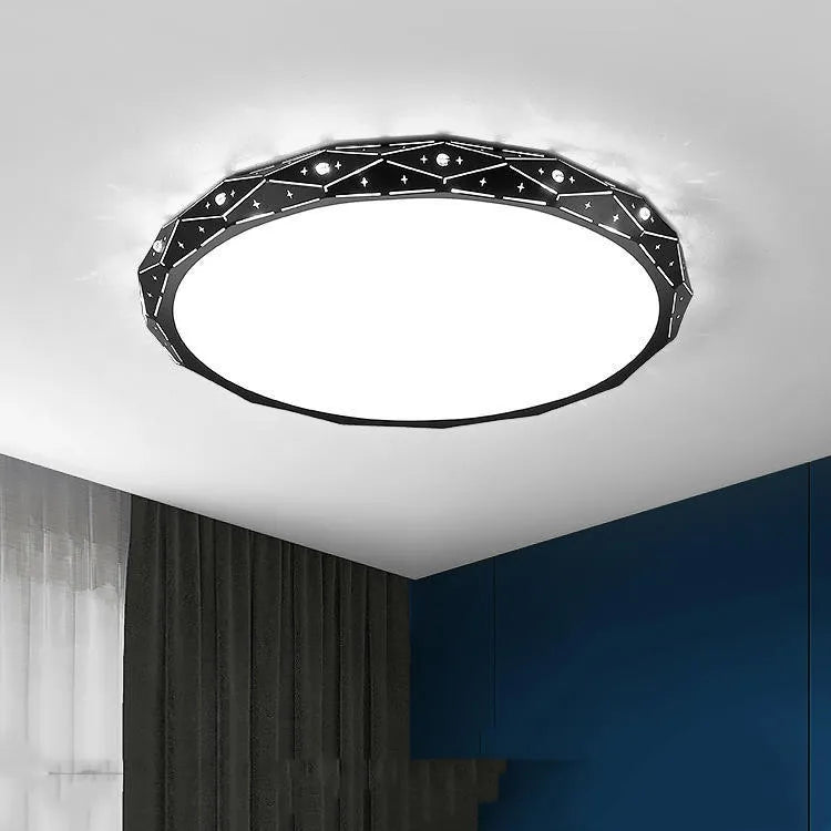 Round black and white framed LED ceiling light fixture for room installation.