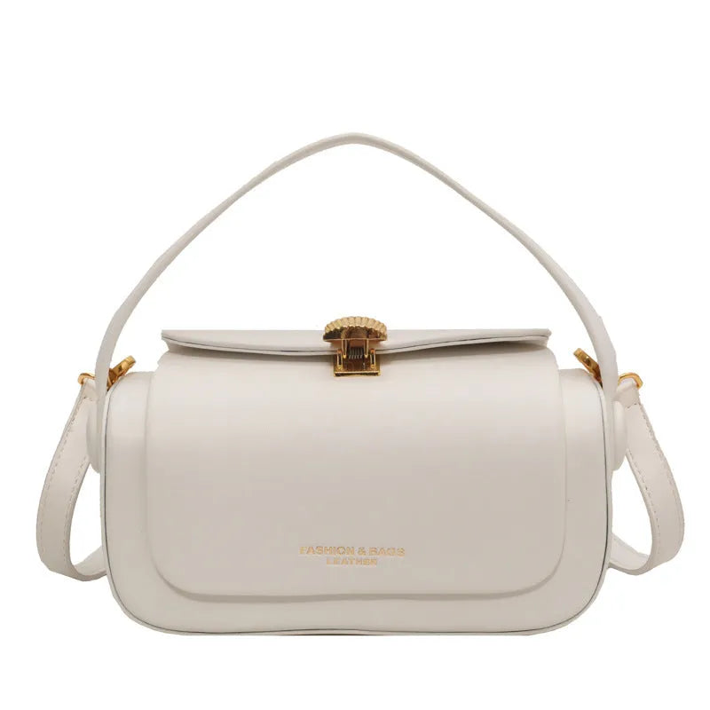 Women's personalised PU messenger bag with letter detailing in beige, shown from the front.