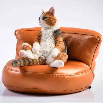 Lazy cat car ornament figure with sofa accessory on dashboard