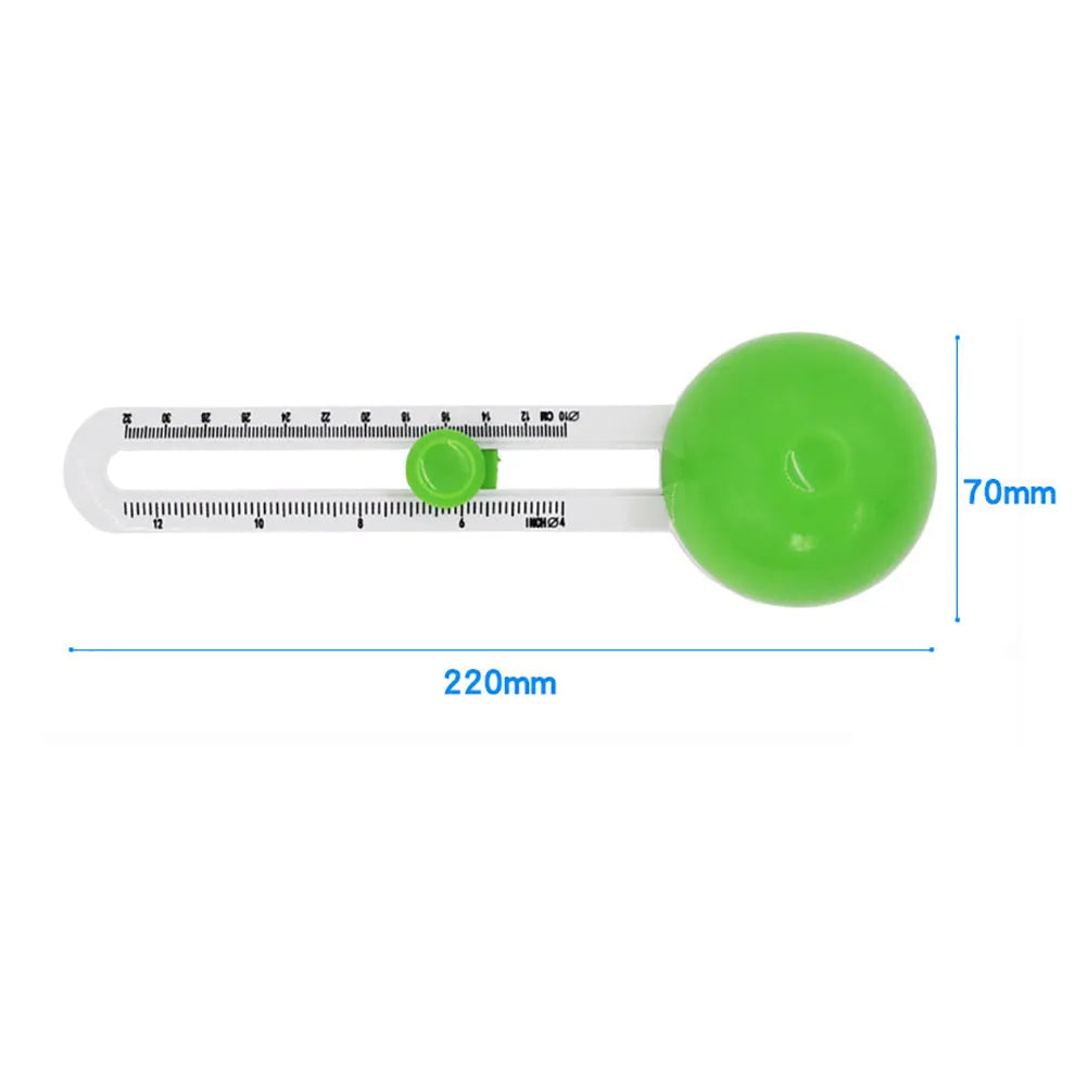 Green and orange plastic round paper cutter for A3 sheets on a colour box.