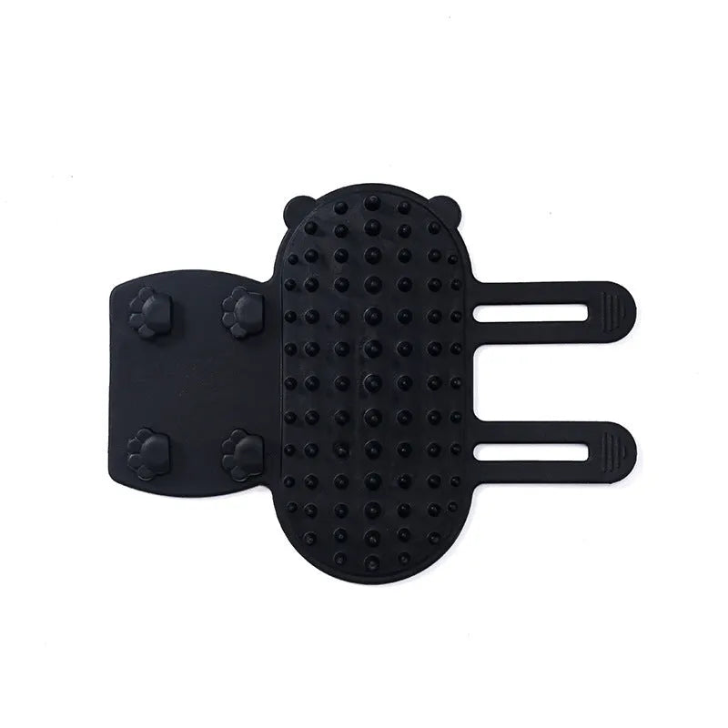 Silicone cat grooming comb with adjustable strap mounted on a table leg, shown in assorted colours.