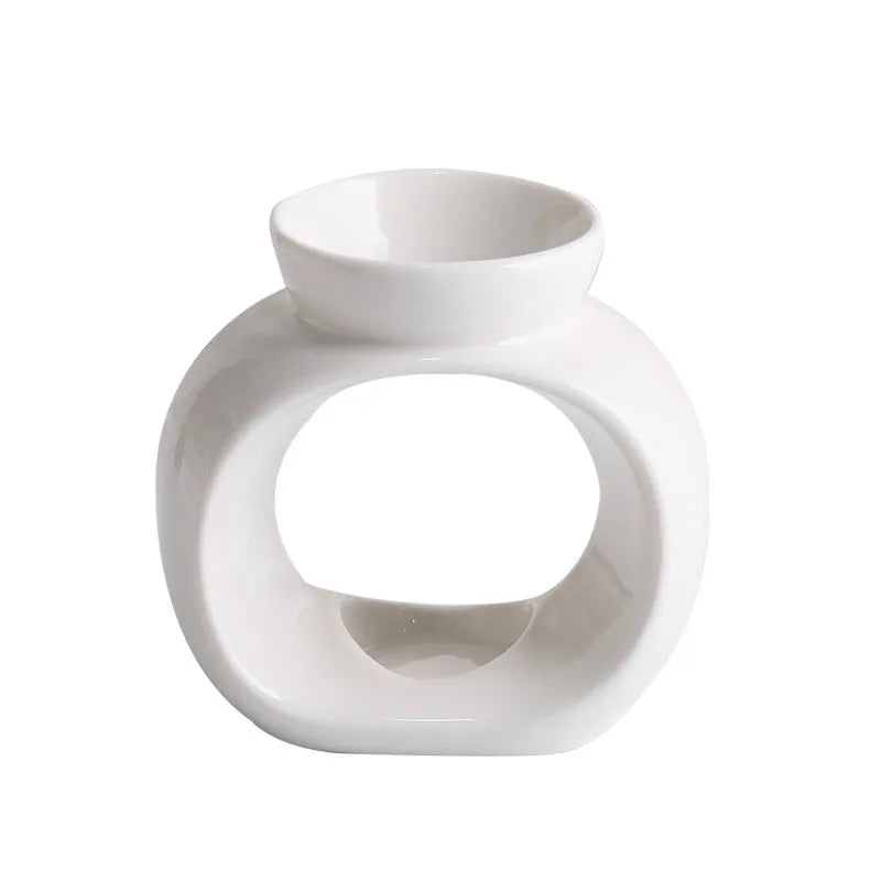White ceramic Nordic style aromatherapy stove ornament measuring 10cm diameter