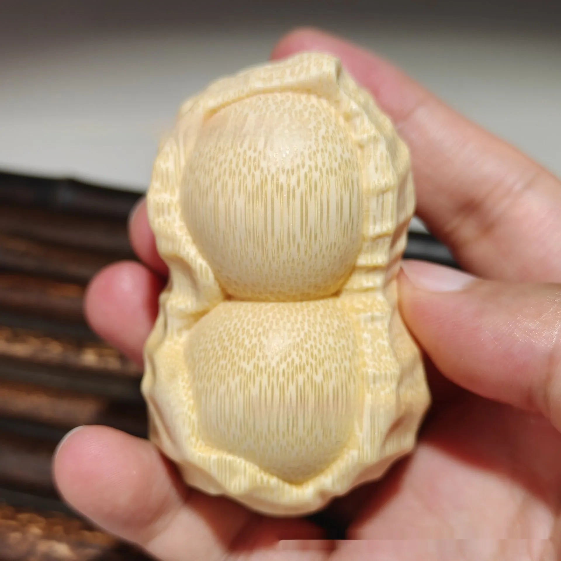 Modern minimalist solid bamboo carving peanut ornament symbolising good fortune