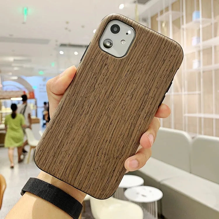 Wooden iPhone back cover case in rosewood finish showing precise cutouts for camera and ports.