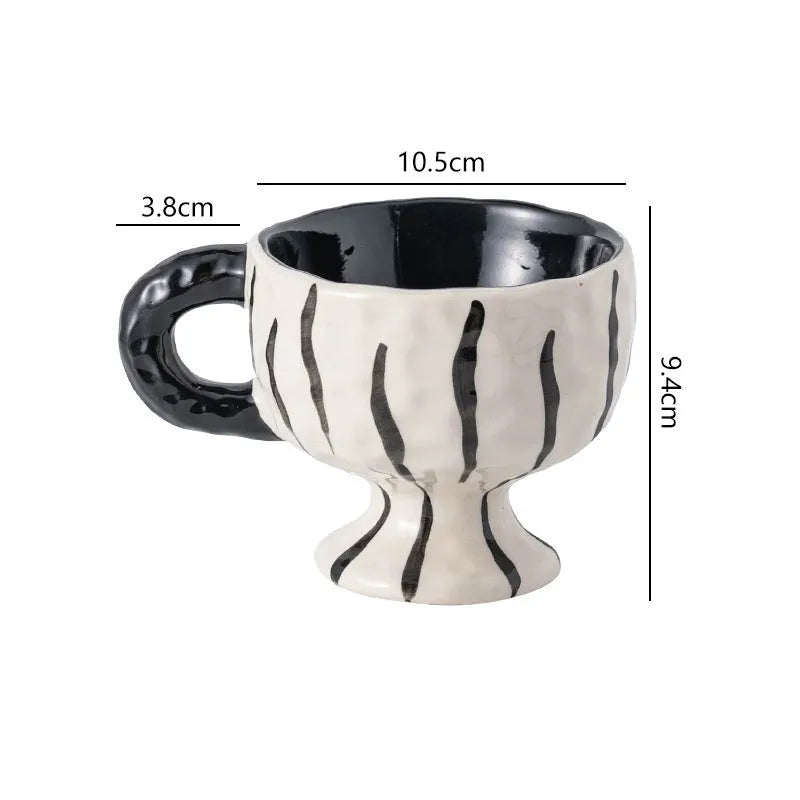 Hand-pinched irregular ceramic mug in solid colour with modern simple design