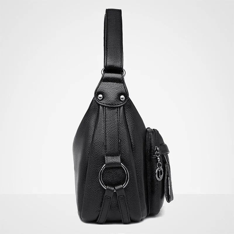 Women's blue soft PU crossbody bag showing interior phone and document compartments with zipper closure