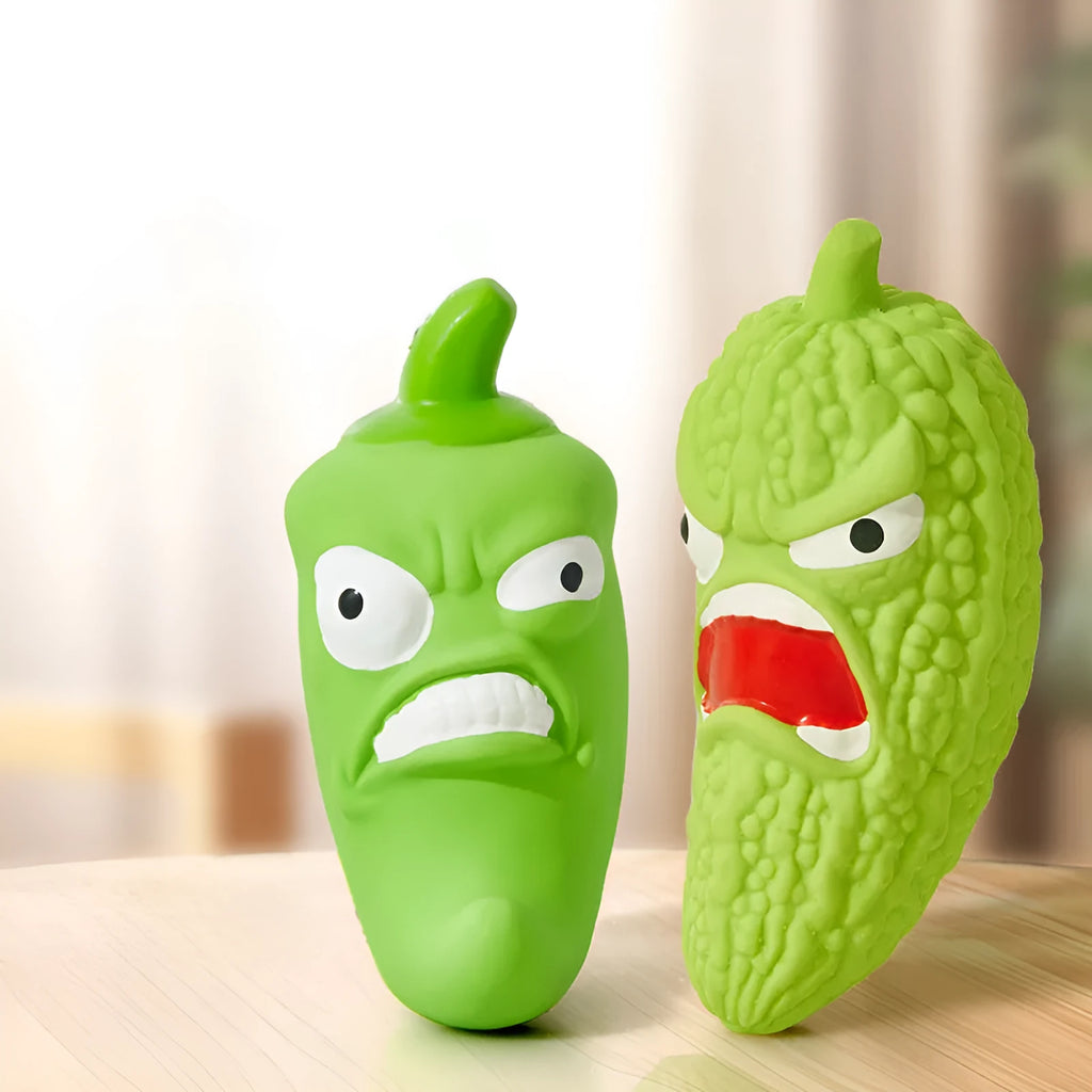 Green bitter melon or red chili shaped dog chew toy with squeaker for dental care and play.
