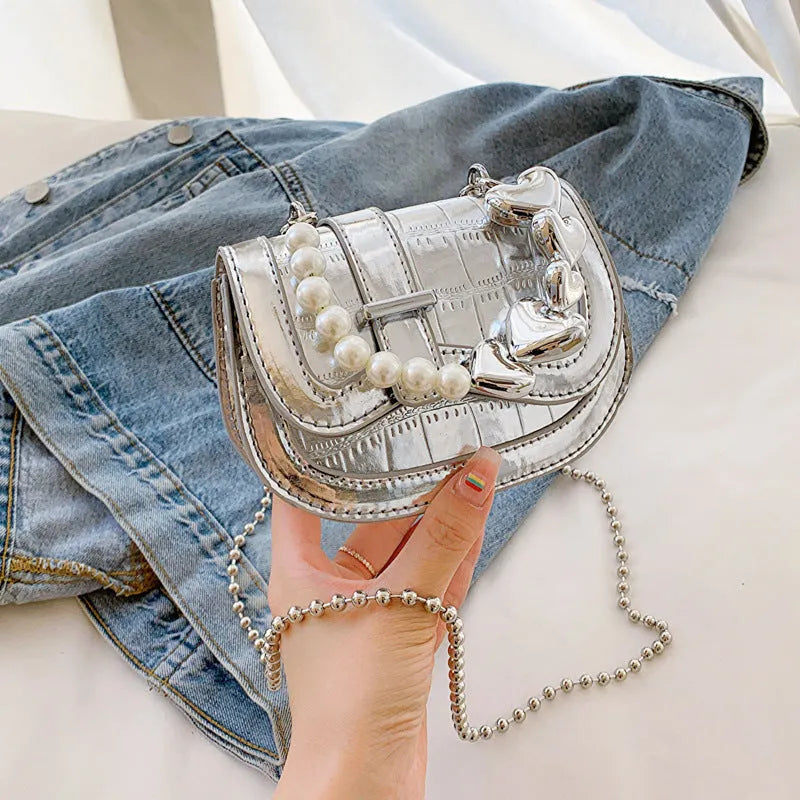 Horizontal square mini saddle bag in PU leather with sandwich pocket detail and adjustable shoulder strap