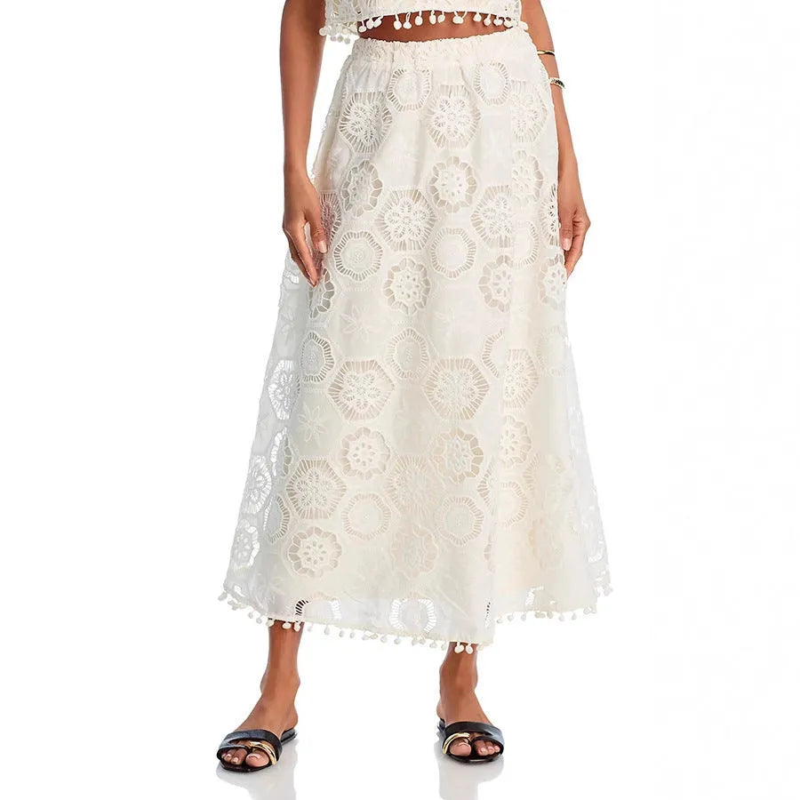 White women's retro suit set with sleeveless top and embroidered long skirt