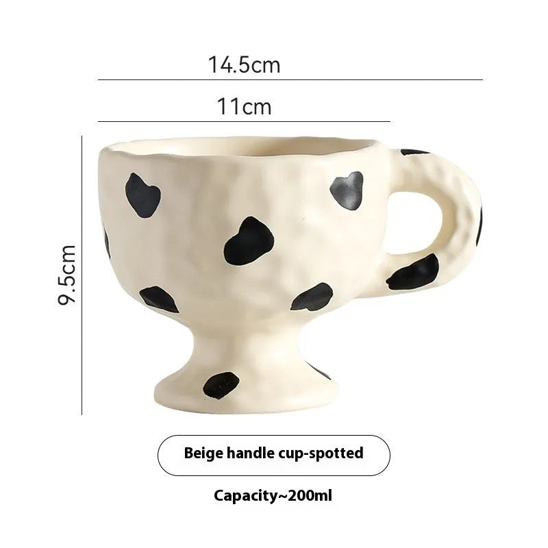 Hand-pinched irregular ceramic mug in solid colour with modern simple design