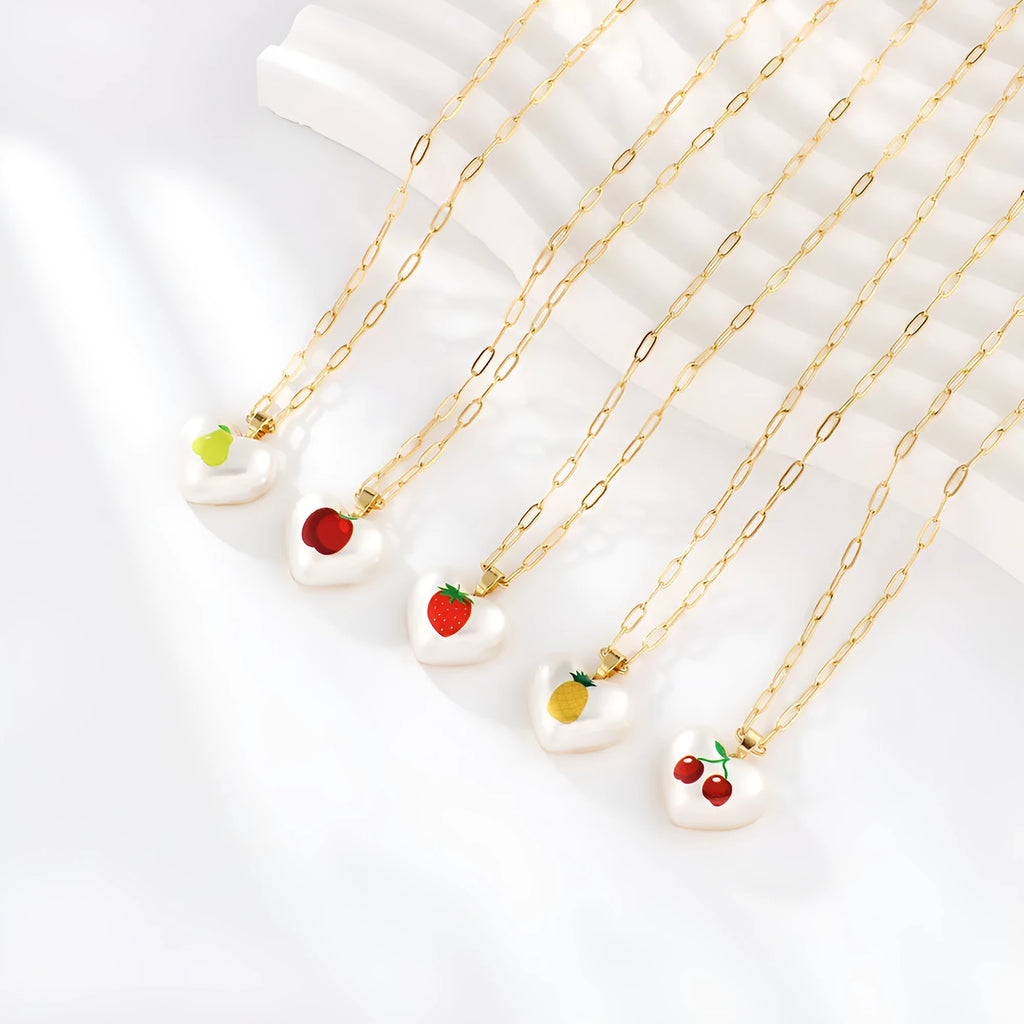 Adjustable girls necklace with a choice of apple, cherry, pear, pineapple, or strawberry heart-shaped pendant.