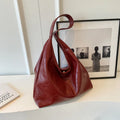 Casual soft PU leather large capacity shoulder bag in street trend style.