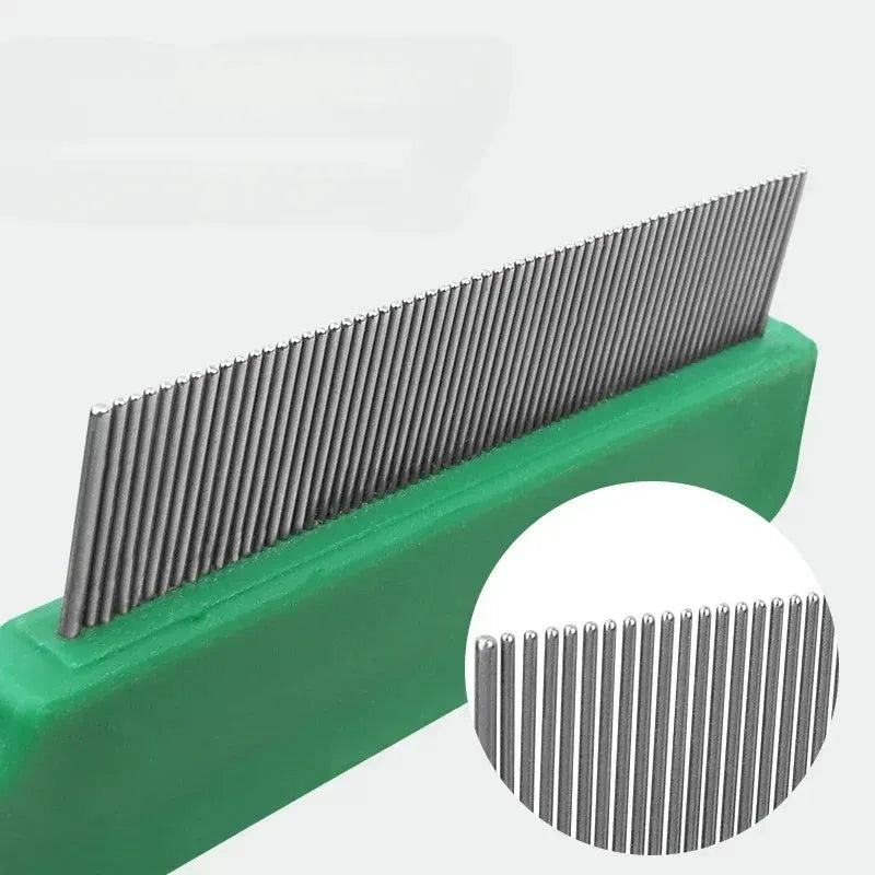 Green plastic handle stainless steel pin flea comb for dogs and cats on a white background.