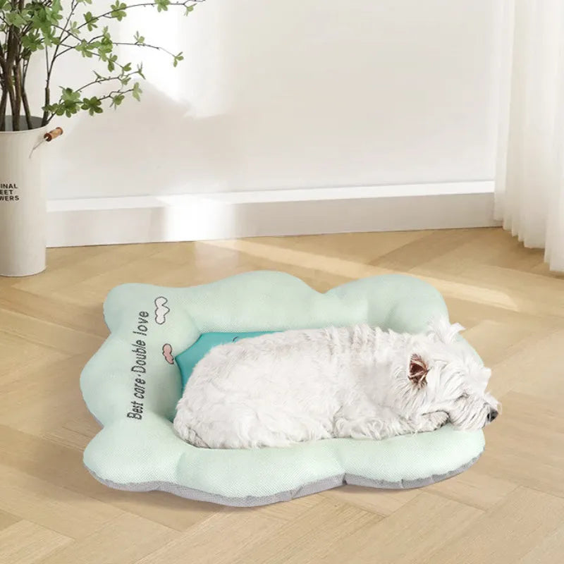 Green pet cooling mat for a medium-sized dog lying on a floor.