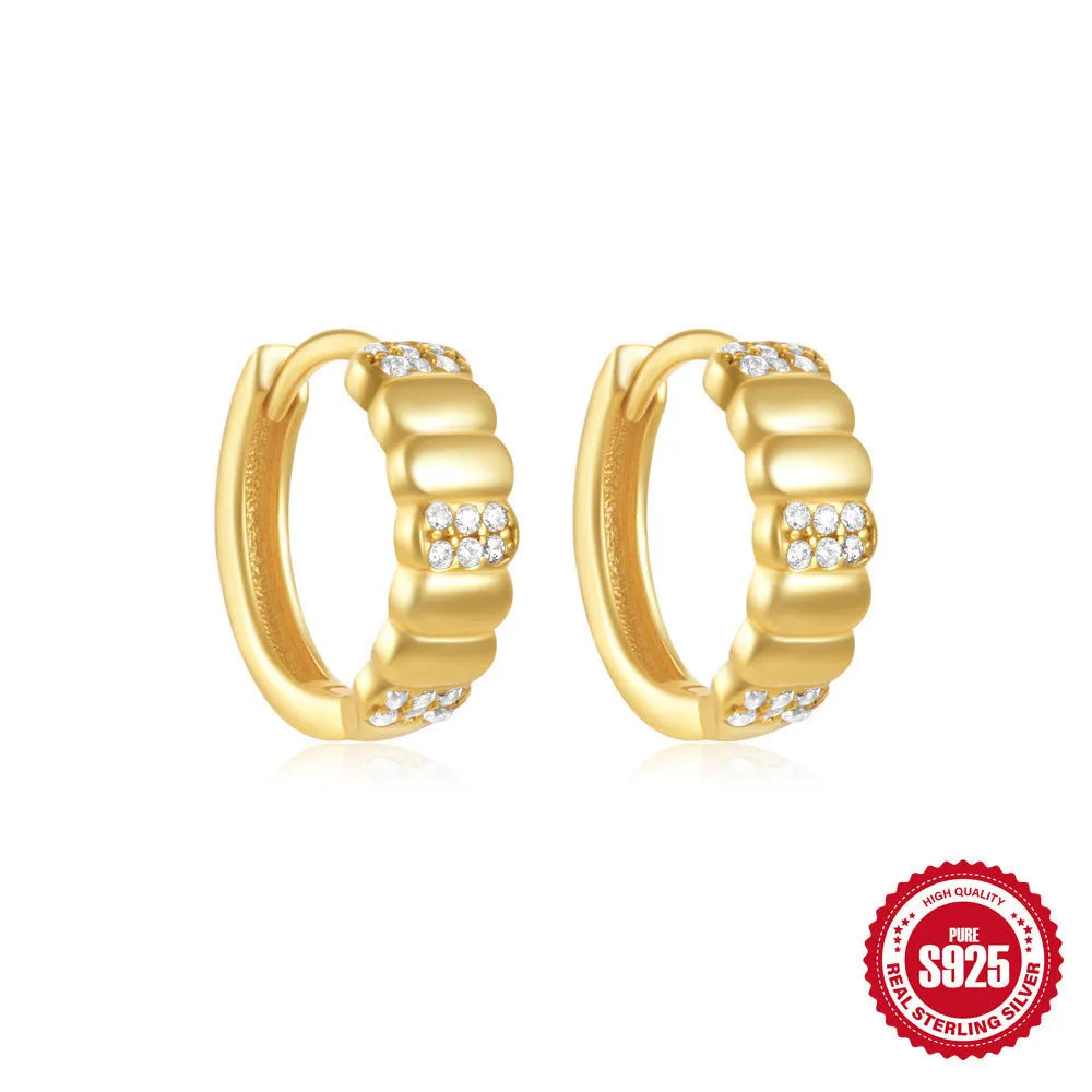 Sterling silver geometric stud earrings with small round design elements in gold or silver finish