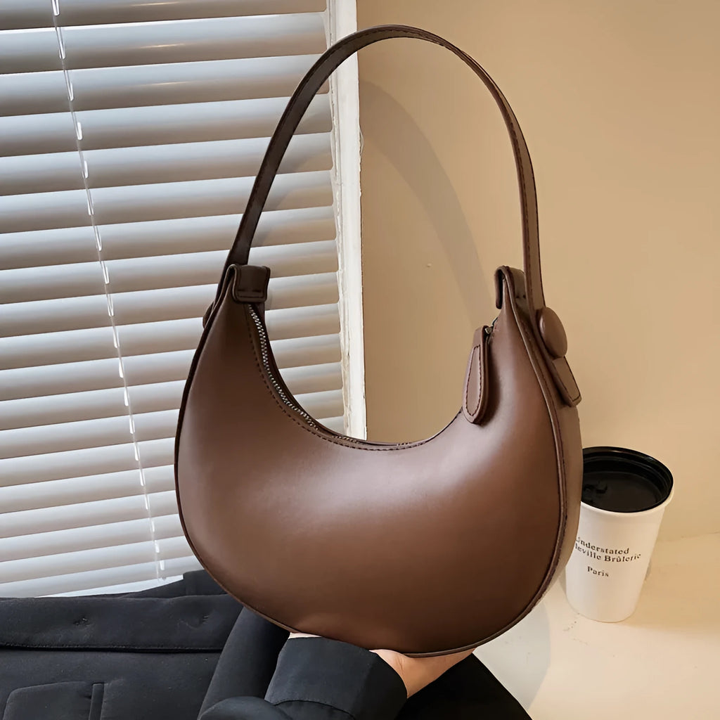 Women's retro dumpling shape shoulder bag in black with sandwich pocket design