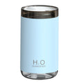 Blue jellyfish humidifier on a table emitting smoke ring mist with warm night light glow